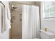 Clean bathroom with shower featuring tiled walls and shower head with detachable head at 212 Southerby Dr, Garner, NC 27529