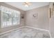 Bedroom with white walls and a large window that fills the room with natural light at 212 Southerby Dr, Garner, NC 27529