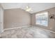 Bright, minimalist bedroom with vaulted ceiling, offering a blank canvas for personal touches and decor at 212 Southerby Dr, Garner, NC 27529