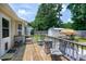 Wooden deck with seating and fire pit, overlooking the backyard and shed, ideal for outdoor relaxation at 212 Southerby Dr, Garner, NC 27529