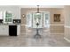 Charming kitchen nook with bay window, a table setting, and natural light at 212 Southerby Dr, Garner, NC 27529