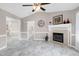 Bright living room featuring a fireplace with a tiled hearth and open layout at 212 Southerby Dr, Garner, NC 27529