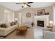 Cozy living room with fireplace, comfortable seating, and neutral tones for a welcoming atmosphere at 212 Southerby Dr, Garner, NC 27529