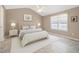 Serene main bedroom with vaulted ceiling, neutral decor, plush bedding, and plenty of natural light at 212 Southerby Dr, Garner, NC 27529