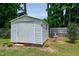 Exterior view of shed with garden ornament and lattice foundation, providing practical outdoor storage space at 212 Southerby Dr, Garner, NC 27529