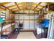 Spacious storage shed with ample shelving, exposed beams, and room for tools and equipment at 212 Southerby Dr, Garner, NC 27529