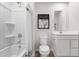 White bathroom with a combination shower and tub and a neutral color palette at 214 Bluebell St, Sanford, NC 27330