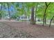 Secluded backyard features patio area and mature trees for privacy and shade at 2310 Turning Pointe Way, Hillsborough, NC 27278