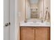 Bathroom featuring a single sink vanity with wooden cabinetry at 2310 Turning Pointe Way, Hillsborough, NC 27278