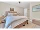 Comfortable bedroom features a large bed, neutral decor, and a ceiling fan for added comfort and lighting at 2310 Turning Pointe Way, Hillsborough, NC 27278