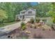 Charming two-story home with gray siding, landscaped yard, and inviting curb appeal at 2310 Turning Pointe Way, Hillsborough, NC 27278