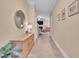 Hallway showcasing decorative accents, stylish flooring, and open flow to living spaces at 2310 Turning Pointe Way, Hillsborough, NC 27278