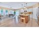 Bright, airy kitchen flows into the dining area, stainless appliances, large kitchen island at 2310 Turning Pointe Way, Hillsborough, NC 27278