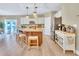 Modern kitchen with a center island, stainless steel appliances, and bright lighting at 2310 Turning Pointe Way, Hillsborough, NC 27278