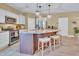 Spacious kitchen featuring a large island, stainless steel appliances, and ample cabinet space at 2310 Turning Pointe Way, Hillsborough, NC 27278