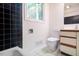 Bathroom features tiled floors and walls with a shower-tub combo at 26 Mt. Bolus Rd, Chapel Hill, NC 27514