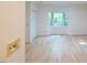 Bedroom with light hardwood floors and bay window at 26 Mt. Bolus Rd, Chapel Hill, NC 27514