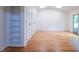 Spacious bedroom with hardwood floors, closet, and a glass sliding door at 26 Mt. Bolus Rd, Chapel Hill, NC 27514