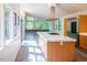 Modern kitchen featuring white countertops, sleek cabinetry, stainless steel appliances, and lots of natural light at 26 Mt. Bolus Rd, Chapel Hill, NC 27514