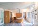 Open kitchen featuring stainless appliances, wood cabinets, white countertops, and an island at 26 Mt. Bolus Rd, Chapel Hill, NC 27514