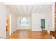 Bright living room with white vaulted ceilings and gleaming wood floors at 26 Mt. Bolus Rd, Chapel Hill, NC 27514