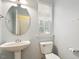 Powder room features a pedestal sink, and natural light at 2614 Laurelcherry St, Raleigh, NC 27612