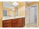 Bathroom with a vanity with drawers and cabinetry, sink, mirror, and doorway at 2614 Laurelcherry St, Raleigh, NC 27612