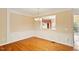 Charming dining room boasts wainscoting and hardwood floors at 2614 Laurelcherry St, Raleigh, NC 27612
