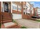 Beautiful townhome exterior featuring brick, garage, and landscaping, creating an inviting curb appeal at 2614 Laurelcherry St, Raleigh, NC 27612