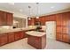 Modern kitchen with stainless steel appliances, granite countertops, and ample cabinet space, perfect for culinary enthusiasts at 2614 Laurelcherry St, Raleigh, NC 27612