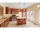 Modern kitchen with stainless steel appliances, granite countertops, and ample cabinet space, perfect for culinary enthusiasts at 2614 Laurelcherry St, Raleigh, NC 27612