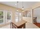 Bright eat-in kitchen with tile floors, recessed lighting, and backyard access at 2614 Laurelcherry St, Raleigh, NC 27612
