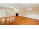 Spacious living room with hardwood floors, fan and fireplace at 2614 Laurelcherry St, Raleigh, NC 27612