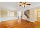 Bright living room with hardwood floors, wainscoting, and staircase access at 2614 Laurelcherry St, Raleigh, NC 27612