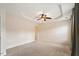 Large main bedroom features a tray ceiling, fan, and carpet at 2614 Laurelcherry St, Raleigh, NC 27612