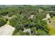 An aerial view of a home surrounded by dense trees and lush greenery at 2642 Holly Springs Church Rd, Broadway, NC 27505