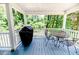 Back porch with covered seating, grill and backyard views at 2642 Holly Springs Church Rd, Broadway, NC 27505