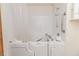 Accessible white walk-in bathtub with safety grab bars and shower fixture at 2642 Holly Springs Church Rd, Broadway, NC 27505