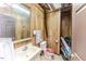 Small bathroom with vanity and sink, mirror, toilet and wood-paneled walls at 2642 Holly Springs Church Rd, Broadway, NC 27505