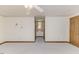 Spacious bedroom with neutral walls, carpet flooring, ceiling fan and multiple closets at 2642 Holly Springs Church Rd, Broadway, NC 27505