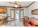 Bright breakfast nook with a ceiling fan and a door to the outdoor deck area at 2642 Holly Springs Church Rd, Broadway, NC 27505