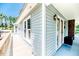 The house has a welcoming side entry porch and large windows at 2642 Holly Springs Church Rd, Broadway, NC 27505