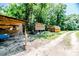 The property includes open sheds and storage buildings for tools and equipment at 2642 Holly Springs Church Rd, Broadway, NC 27505