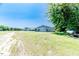 Exterior angle of multiple outbuildings and storage, set in a spacious grassy area at 2642 Holly Springs Church Rd, Broadway, NC 27505