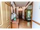 Inviting foyer featuring wood floors, a staircase, and views into other rooms at 2642 Holly Springs Church Rd, Broadway, NC 27505