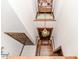 High angle of foyer with hardwood stairs, chandelier and wooden doors at 2642 Holly Springs Church Rd, Broadway, NC 27505