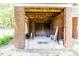The brick garage has an open floor plan with a large storage area at 2642 Holly Springs Church Rd, Broadway, NC 27505