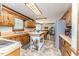 Kitchen featuring wood cabinetry, tiled flooring, and stainless steel appliances at 2642 Holly Springs Church Rd, Broadway, NC 27505