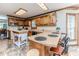Spacious kitchen with light countertops, wooden cabinets, and a center island at 2642 Holly Springs Church Rd, Broadway, NC 27505