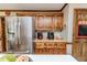 Kitchen features stainless steel refrigerator, wooden cabinets, and countertops at 2642 Holly Springs Church Rd, Broadway, NC 27505